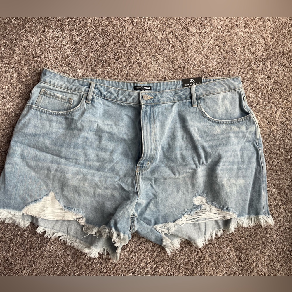 Plus size distressed denim shorts